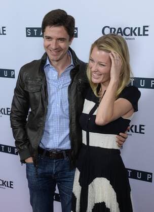 Cast member Ashley Hinshaw (R) and actor Topher Grace attend the premiere of Crackle s TV series crime drama Startup at the London Hotel in West Hollywood, California on August 23, 2016. Storyline: A desperate banker needs to conceal stolen money. A Haitian-American gang lord wants to go legit. A Cuban-American hacker has an idea that will revolutionize the very future of money itself. Forced to work together, they unwittingly create their version of the American dream - organized crime 2.0.  LAP2016082319 JIMxRUYMEN