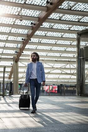 Stylish businessman walking with suitcase model released Symbolfoto  MAUF000771