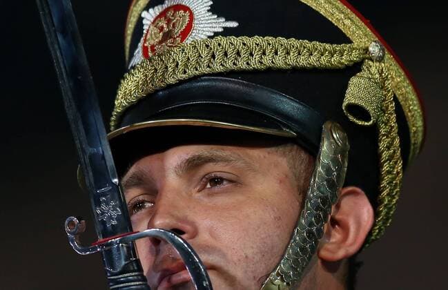 MOSCOW, RUSSIA - AUGUST 27, 2016: A member of the Honor Guard of the Presidential Regiment of Russia performs at the opening of the 9th Spasskaya Tower international military music festival in Moscow s Red Square. Artyom Geodakyan TASS  TS02EFBE