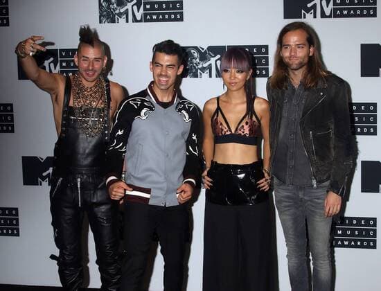 August 28, 2016 - New York, New York, U.S. - Members of DNCE, COLE WHITTLE, JOE JONAS, JINJOO LEE and JACK LAWLESS pose for photos in the press room at the 2016 MTV Video Music Awards held at Madison Square Garden. New York U.S. - ZUMAk03_