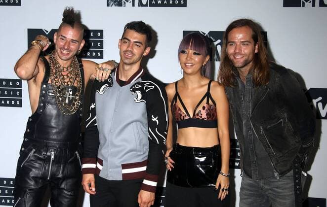 August 28, 2016 - New York, New York, U.S. - Members of DNCE, COLE WHITTLE, JOE JONAS, JINJOO LEE and JACK LAWLESS pose for photos in the press room at the 2016 MTV Video Music Awards held at Madison Square Garden. New York U.S. - ZUMAk03_