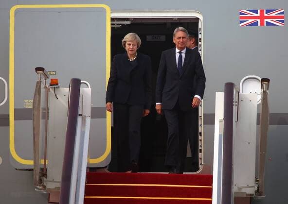 Britain s new Prime Minister Theresa May and Chancellor of the Exchequer Philip Hammond disembark a Royal Air Force jet upon arriving for the G20 Summit in Hangzhou, the capital of Zhejiang Province, on September 4, 2016. U.S. President Obama is expected to meet May for the first time as she manages her country s exit from the European Union.  HGH2016090409 STEPHENxSHAVER