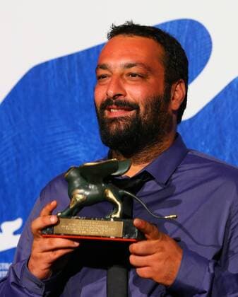 VENICE, Sept. 10, 2016 -- Director Ala Eddine Slim poses with the Lion of the Future Luigi de Laurentiis Venice award for the movie The Last of Us during the award winners photocall of the 73rd Venice Film Festival in Venice, Italy, on Sept. 10, 2016. )(axy) ITALY-VENICE-73RD FILM FESTIVAL-AWARD GongxBing 