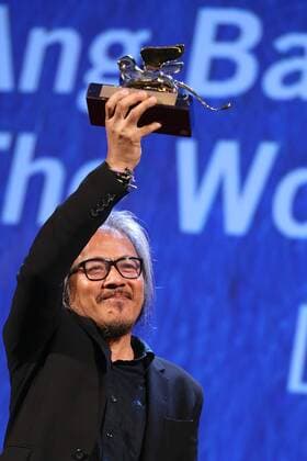 VENICE, Sept. 10, 2016 -- Director Lav Diaz holds the Golden Lion prize for his movie The Woman Who Left during the award ceremony at the 73rd Venice Film Festival, at the Lido of Venice, Italy, Sept. 10, 2016. The Woman Who Left by Philippine director Lav Diaz won the Golden Lion, the highest prize presented at the 73rd Venice International Film Festival which concluded here on Saturday evening. )(axy) ITALY-VENICE-73RD FILM FESTIVAL-AWARD JinxYu 