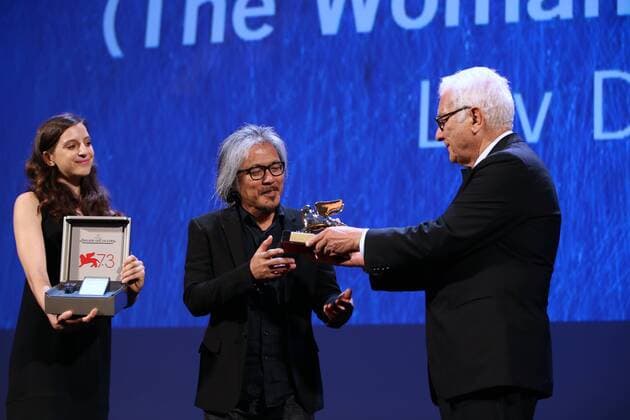 VENICE, Sept. 10, 2016 -- Director Lav Diaz (C) receives the Golden Lion prize for his movie The Woman Who Left during the award ceremony at the 73rd Venice Film Festival, at the Lido of Venice, Italy, Sept. 10, 2016. The Woman Who Left by Philippine director Lav Diaz won the Golden Lion, the highest prize presented at the 73rd Venice International Film Festival which concluded here on Saturday evening. )(axy) ITALY-VENICE-73RD FILM FESTIVAL-AWARD JinxYu 