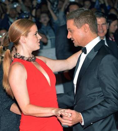 Amy Adams and Jeremy Renner do a little dance on the red carpet as they arrive at the Toronto International Film Festival premiere of Arrival at Roy Thomson Hall in Toronto, Canada on September 12, 2016.  TOR2016091234 CHRISTINExCHEW