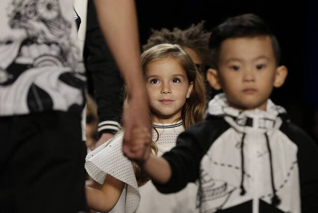 A child model walks on the runway at the Comme Tu Es fashion show during New York Fashion Week: The Shows at The Dock, Skylight at Moynihan Station in New York City on September 13, 2016.  NYP20160913512 JOHNxANGELILLO