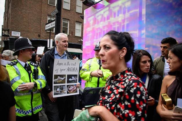 UK: LFW targeted by Animal Cruelty Protestors Metropolitan Police Service officers stand by as animal rights protesters target audiences exiting a London Fashion Week s runway show. FOR EDITORIAL USE ONLY.Pacific Press Agency  HughxPeterswald