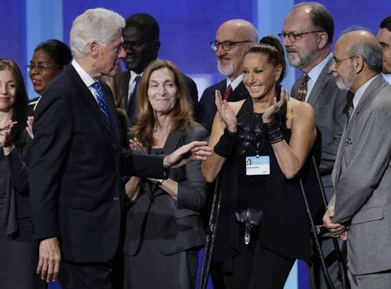 Donna Karan applauds as former president of the United States Bill Clinton walks by at the Clinton Global Initiative at the Sheraton Hotel in New York City on September 19, 2016.  NYP20160919113 JOHNxANGELILLO