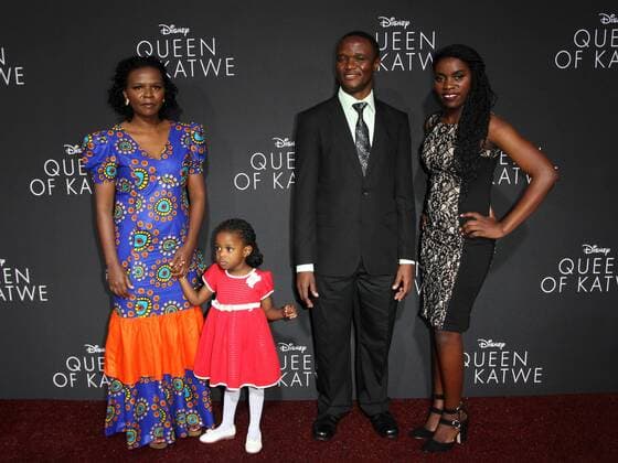 September 20, 2016 - Hollywood, CA, United States - 20 September 2016 - Hollywood, California - Robert Katende with wife Sarah, daughter and Phiona Mutesi. Ã¢â‚¬Å Queen Of KatweÃ¢â‚¬Â Los Angeles Premiere held at the El Capitan Theater in Hollywood. Photo Credit: AdMedia Hollywood United States - ZUMAa123