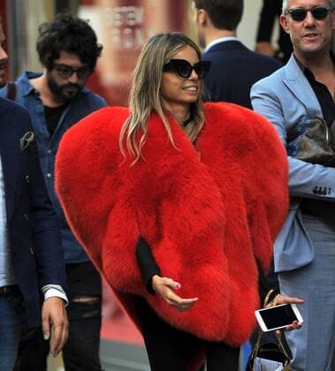Milan, Fur heart-shaped E began the week of women s fashion, and in the center there s people wearing some curious heads and extravagant, albeit signed. In the photo a girl walks in via Montenapoleone wearing a fur coat in a heart shape, a Moschino s signature.  Copyright: xMimmoxCarrierox