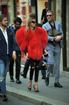 Milan, Fur heart-shaped E began the week of women s fashion, and in the center there s people wearing some curious heads and extravagant, albeit signed. In the photo a girl walks in via Montenapoleone wearing a fur coat in a heart shape, a Moschino s signature.  Copyright: xMimmoxCarrierox