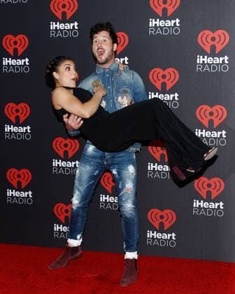 Olympic gymnast Laurie Hernandez and Val Chmerkovskiy arrive for the iHeartRadio Music Festival at the T-Mobile Arena in Las Vegas, Nevada on September 23, 2016.  LVP2016092355 JAMESxATOA