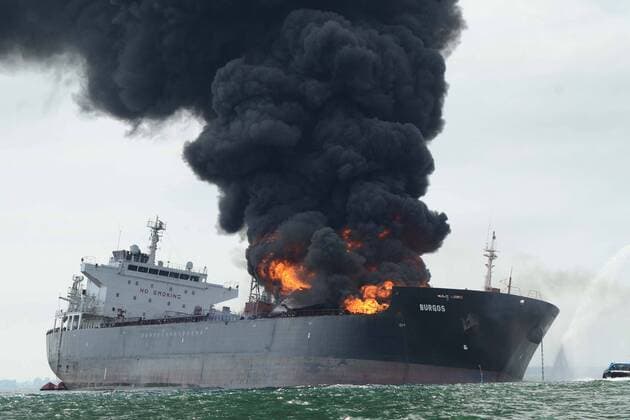 September 24, 2016 - Mexico - A column of dark smoke rises from a gas tank ship belonging to Mexican oil company Pemex, after an explosion, in front of the coast of Veracruz, Mexico, 24 September 2016. The accident took place seven miles away from the Guf s coasts where the ship Burgos carried 80 thousand barrels of diesel, 71 barrels of magna and 26 thousand barrels of gasoline  - ZUMAu78_