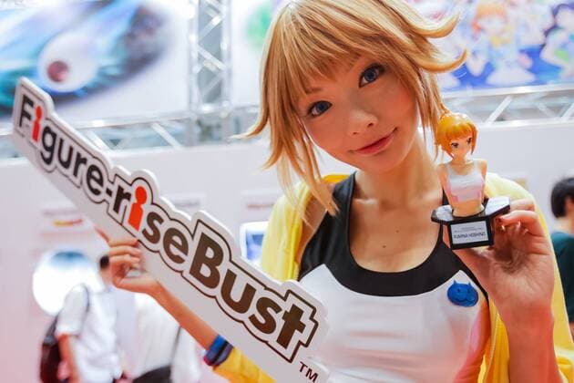 An exhibitor poses for a photograph at the 56th All Japan Model & Hobby Show in Tokyo Big Sight on September 25, 2016. The exhibition introduced hobby goods such as plastic models, action figures, drones, and airsoft guns.  (gxta_alljpnmodelhobbyshow005)