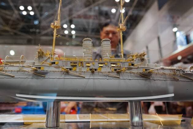 A visitor looks at a replica of the Japanese battleship Mikasa on display at the 56th All Japan Model & Hobby Show in Tokyo Big Sight on September 25, 2016. The exhibition introduced hobby goods such as plastic models, action figures, drones, and airsoft guns.  (gxta_alljpnmodelhobbyshow016)