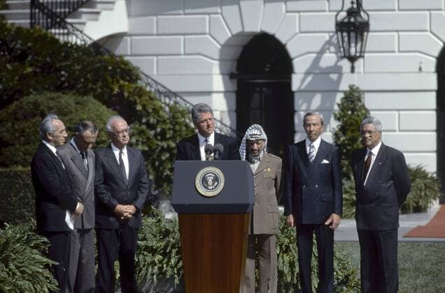 September 13, 1993 - Washington, District of Columbia, U.S - President WILLIAM (Bill) CLINTON hosts the signing ceremony for the Israeli-Palestinian Declartion of Principles on the South Lawn of the White House. The document was signed by Israeli Prime Minister YITZHAK RABIN, Chairman YASSER ARAFAT, Israel Foreign Minister SHIMON PERES and PLO s MAHMOUD ABBAS, U.S. Secretary of State WARREN CHRISTOPHER for the United States and foreign minister ANDREI KOZYREV for Russia. The Oslo I Accord or Oslo I, officially called the Declaration of Principles on Interim Self-Government Arrangements or short Declaration of Principles (DOP), was an attempt in 1993 to set up a framework that would lead to the resolution of the ongoing Israeli-Palestinian conflict. It was the first face-to-face agreement between the government of Israel and the Palestine Liberation Organization (PLO). Negotiations conce - ZUMAr142