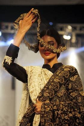 (160928) -- LAHORE, Sept. 28, 2016 -- A model presents a creation of HSY collection during the Pakistan Fashion Design Council(PFDC) L Oreal Paris Bridal Week in eastern Pakistan s Lahore on Sept. 28, 2016. ) PAKISTAN-LAHORE-BRIDAL FASHION WEEK JamilxAhmed 