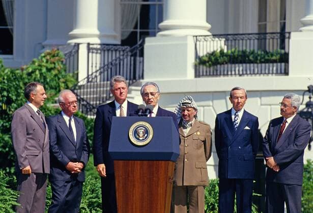 September 13, 1993 - Washington, District of Columbia, United States of America - Minister of Foreign Affairs of Israel Shimon Peres makes remarks during the signing ceremony of the historic Israeli-PLO Agreement, known as the Oslo 1 Accord, on the South Lawn of the White House in Washington, DC on September 13, 1993. Pictured, from left to right: From left to right are: Foreign Minister Andrei Kozyrev of Russia; Prime Minister Yitzhak Rabin of Israel; United States President Bill Clinton; Peres; Chairman Yasser Arafat of the Palestine Liberation Organization (PLO); US Secretary of State Warren Christopher; and Arafat aide Mahmoud Abbas..Credit: CNP Washington United States of America - ZUMAs152