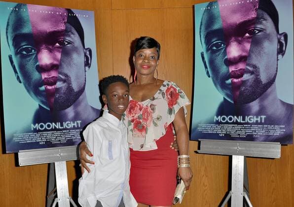 Actor Alex Hibbert and his mother Donna Wellington arrive at the Los Angeles premiere of Moonlight at the DGA Theater in Los Angeles, California on October 13, 2016.  LAP20161013708 CHRISTINExCHEW