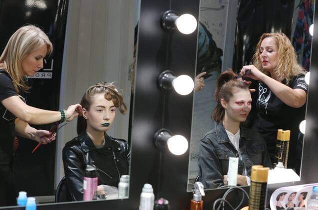 MOSCOW, RUSSIA - OCTOBER 16, 2016: Models have their hair done ahead of a runway show for the Spring Summer 2017 collection by Russian fashion designer Yegor Zaitsev at the Mercedes-Benz Fashion Week Russia in the Manege Central Exhibition Hall. Vyacheslav Prokofyev TASS  TS034B09