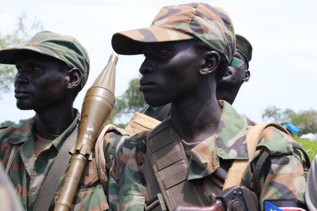 Photo taken on Oct. 16, 2016 shows South Sudan s government troops on a military truck preparing a journey to the frontline in Malakal, South Sudan. Fresh clashes between government and opposition forces near the northern town of Malakal have killed at least 56 over the weekend, a military spokesman said late Sunday. ) (dtf) SOUTH SUDAN-MALAKAL-CONFLICT GalexJulius 