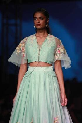 NEW DELHI, INDIA - OCTOBER 15: A model showcases the creation of designer Mandira Wirk during Amazon India Fashion Week Spring-Summer 17 at NSIC Exhibition Complex on October 15, 2016 in New Delhi, India. (Photo by Amal Ks Hindustan Times) Amazon India Fashion Week Spring Summer 2017