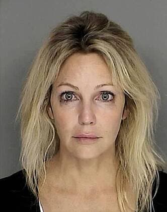 Sep 29, 2008 - Santa Barbara, California, USA - Actress HEATHER LOCKLEAR, who sought medical help for depression this year, was arrested this weekend outside the coastal city of Santa Barbara, the California Highway Patrol said on Sunday. The Los Angeles Times reported that the 47-year-old star of television shows such as Melrose Place was arrested on Saturday night. A California Highway Patrol official confirmed the arrest but gave no details. A spokeswoman for Locklear was not immediately available. Locklear checked into an Arizona medical facility in June suffering from anxiety and depression. News reports said on Saturday that a witness saw Locklear driving erratically when leaving a parking lot. A California Highway Patrol officer later found her car parked on a highway and blocking a traffic lane in Montecito, near Santa Barbara, about 90 miles northwest of Los Angeles. The offic - ZUMAz03_ 20080929_rua_z03_014