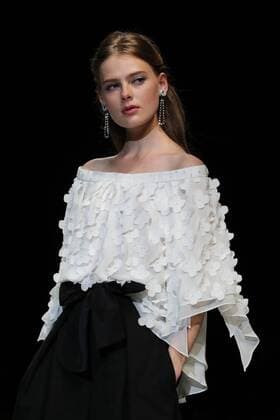 October 18, 2016, Tokyo, Japan - A model displays a creation of Japanese designer Yuki Torii at her 2017 spring summer collection in Tokyo as a part of Japan Fashion Week on Tuesday, October 18, 2016.  (lwxa005514)