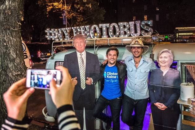 Man pose next to real-size cardboard cut outs of Republican presidential candidate Donald Trump and Democratic presidential candidate Hillary Clinton outside a New York theater screening the premiere of the documentary Michael Moore In TrumpLand on October 18, 2016. Filmmaker Michael Moore had finished editing the film the previous day and made a surprise last-minute announcement on Twitter that he would show it for free today. The film will play for a week in Los Angeles and New York starting tomorrow. Photo by Enrique Shore Cordon Press  ENRIQUExSHORE Men pose next to real-size cardboard cut outs of Donald Trump an