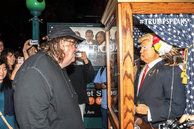 US filmmaker Michael Moore laughs as he listens to a fortune-telling fairground attraction representing Republican presidential candidate Donald Trump upon arriving to a New York theater to attend the premiere of his documentary Michael Moore In TrumpLand on October 18, 2016. Moore had finished editing the film the previous day and made a surprise last-minute announcement on Twitter that he would show it for free today. The film will play for a week in Los Angeles and New York starting tomorrow. Photo by Enrique Shore Cordon Press  ENRIQUExSHORE Director Moore watches robot of Trump before premiere of his doc