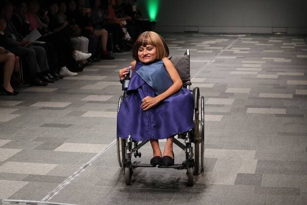October 19, 2016, Tokyo, Japan - A Nepalese disabled person Anjana K.C. displays creation of Japanese designer Takafumi Tsuruta at the tenbo 2017 spring summer collection as a part of Japan Fashion Week in Tokyo on Wednesday, October 19, 2016.  (lwxa005552)