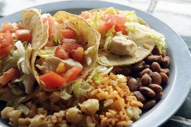 Oct. 16, 2008 - Albuquerque, NM, U.S. - north. Detail of a chicken taco plate with beans, rice and posole, photographed at The Burrito Co. Cafe on Washington Ave. in Santa Fe, photographed Tuesday April 26, 2011. - ZUMAab1_ 20081016_zaf_ab1_152
