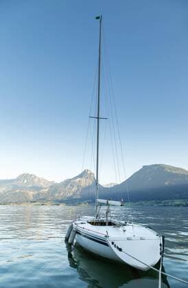 Austria, Sankt Wolfgang, moored sailing boat on lake  JUNF00630