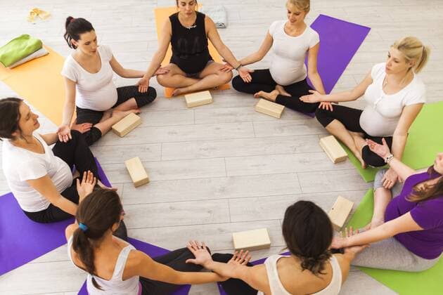 Prenatal yoga class sitting together in circle model released Symbolfoto property released  ZEDF00369