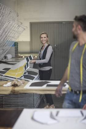 Man and woman working in tailor shop model released Symbolfoto property released  ZEF10681