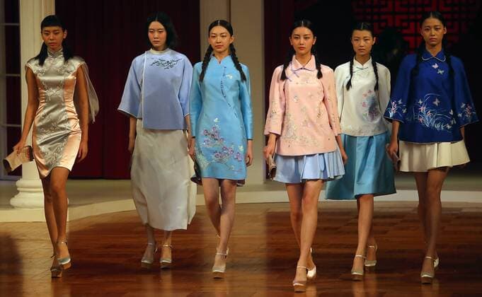 Chinese models wear clothing from the NE Tiger 2017 collection during China s international fashion week in Beijing on October 25, 2016. Chinese fashion designers are becoming an international force with both European and American fashion houses looking at the new, fresh Chinese clothing-minds as potential partners in future clothing brands.  PEK2016102505 STEPHENxSHAVER