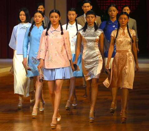 Chinese models wear clothing from the NE Tiger 2017 collection during China s international fashion week in Beijing on October 25, 2016. Chinese fashion designers are becoming an international force with both European and American fashion houses looking at the new, fresh Chinese clothing-minds as potential partners in future clothing brands.  PEK2016102507 STEPHENxSHAVER