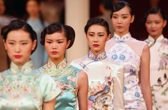 Chinese models wear clothing from the NE Tiger 2017 collection during China s international fashion week in Beijing on October 25, 2016. Chinese fashion designers are becoming an international force with both European and American fashion houses looking at the new, fresh Chinese clothing-minds as potential partners in future clothing brands.  PEK2016102523 STEPHENxSHAVER