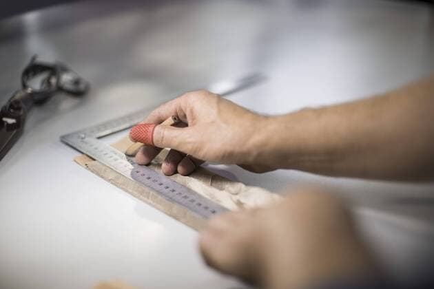 Tailor measuring cloth in designer factory model released Symbolfoto property released  ZEF10517