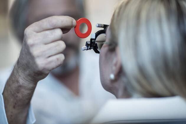 Optometrist adjusting test frame for patient model released Symbolfoto property released  ZEF10568