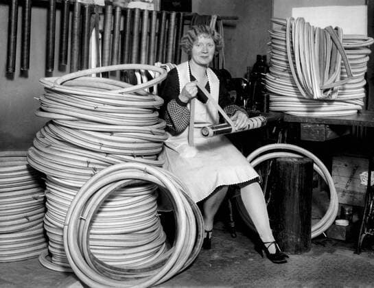Newark, New Jersey: February 2, 1927 Mrs. Ernie Pye making racing tires for bicycles. her late husband, a professional rider, developed the racing tire and the company. xUnderwoodxArchives 3-Rec-Bike-Mfg_1