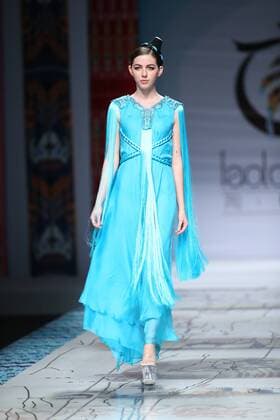 October 27, 2016 - Beijing, Beijing, China - Beijing,CHINA-October 27 2016: (EDITORIAL USE ONLY. CHINA OUT) ..A model presents a creation designed by designer Tao Tao at China Fashion Week in Beijing, October 27th, 2016.The fashion show is themed with Loulan Kingdom, which was an ancient kingdom based around an important oasis city along the Silk Road on the northeastern edge of the Lop Desert in China. Beijing China  - ZUMAs145 20161027_zaa_s145_198