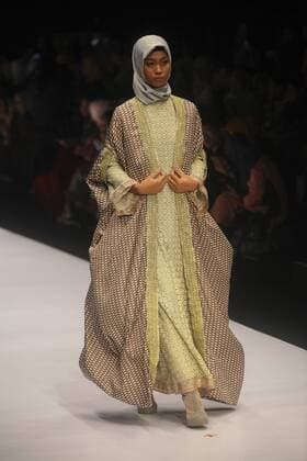 October 28, 2016 - Jakarta, Jakarta, Indonesia - A model walks on the runway to present Indonesian Muslim designer, Anniesa Hasibuan during the Jakarta Fashion Week in Jakarta, Indonesia, on October 28, 2016. Anniesa Hasibuan, 30, has made history by presenting the first ever collection at New York Fashion Week (NYFW) last month to feature hijabs in every look. She also the first Indonesian to have a show at an official NYFW venue. Her collection, called D Jakarta, featured headscarves in gold, silver and pink, metallic silver and gold long skirts, beaded shiny jackets and silky pants. Jakarta Indonesia - ZUMAn230 20161028_zaa_n230_321