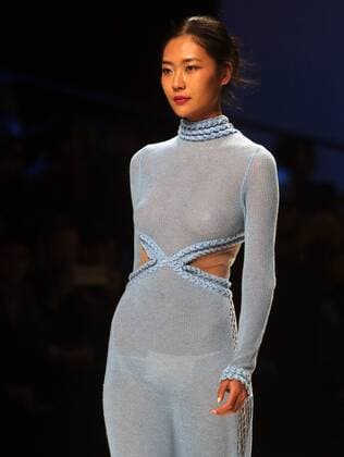 Chinese and European models wear clothing from the Lotus 2017 collection during China s international fashion week in Beijing on October 31, 2016. Chinese fashion designers are becoming an international force with both European and American fashion houses looking at the new, fresh Chinese clothing-minds as potential partners in future clothing brands.  PEK2016103106 STEPHENxSHAVER