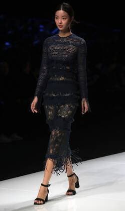 Chinese and European models wear clothing from the Lotus 2017 collection during China s international fashion week in Beijing on October 31, 2016. Chinese fashion designers are becoming an international force with both European and American fashion houses looking at the new, fresh Chinese clothing-minds as potential partners in future clothing brands.  PEK2016103125 STEPHENxSHAVER