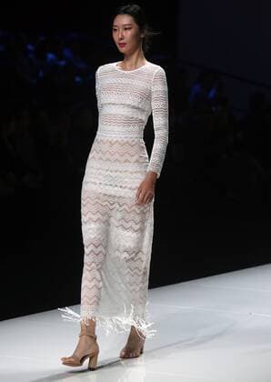 Chinese and European models wear clothing from the Lotus 2017 collection during China s international fashion week in Beijing on October 31, 2016. Chinese fashion designers are becoming an international force with both European and American fashion houses looking at the new, fresh Chinese clothing-minds as potential partners in future clothing brands.  PEK2016103127 STEPHENxSHAVER