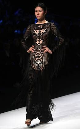 Chinese and European models wear clothing from the Lotus 2017 collection during China s international fashion week in Beijing on October 31, 2016. Chinese fashion designers are becoming an international force with both European and American fashion houses looking at the new, fresh Chinese clothing-minds as potential partners in future clothing brands.  PEK2016103130 STEPHENxSHAVER