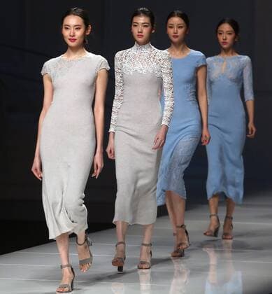 Chinese and European models wear clothing from the Lotus 2017 collection during China s international fashion week in Beijing on October 31, 2016. Chinese fashion designers are becoming an international force with both European and American fashion houses looking at the new, fresh Chinese clothing-minds as potential partners in future clothing brands.  PEK2016103134 STEPHENxSHAVER