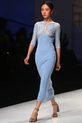 Chinese and European models wear clothing from the Lotus 2017 collection during China s international fashion week in Beijing on October 31, 2016. Chinese fashion designers are becoming an international force with both European and American fashion houses looking at the new, fresh Chinese clothing-minds as potential partners in future clothing brands.  PEK2016103103 STEPHENxSHAVER